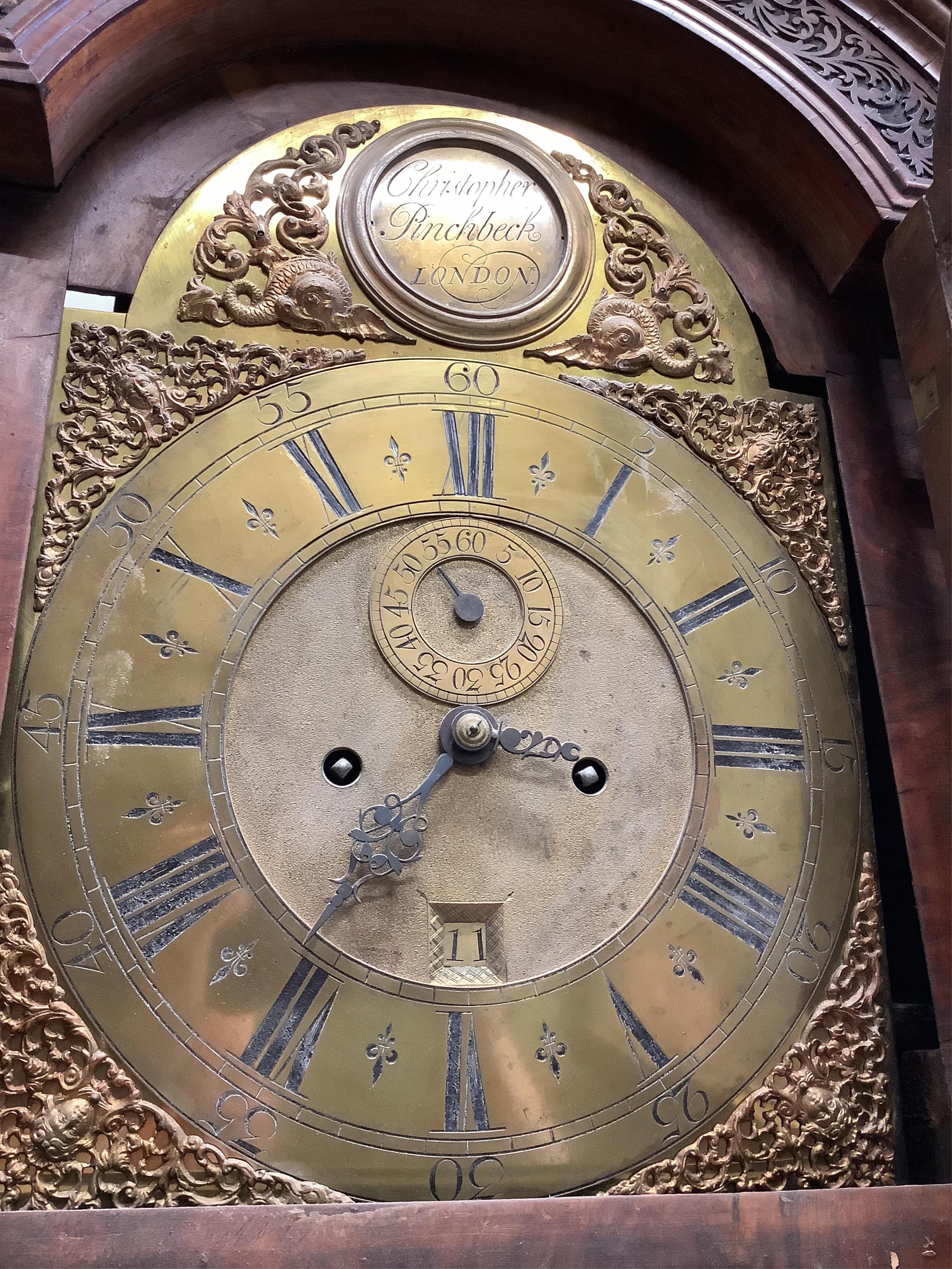 A George II walnut and feather banded longcase clock, Christopher Pinchbeck, London, height 237cm. Condition - poor